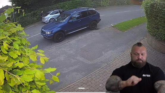 Security camera footage of Eddie Hall outside his house.
