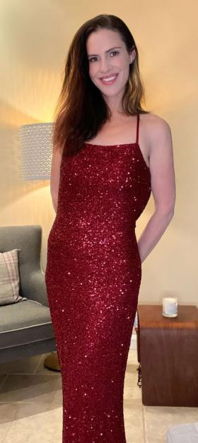 Woman in a sequined red dress.