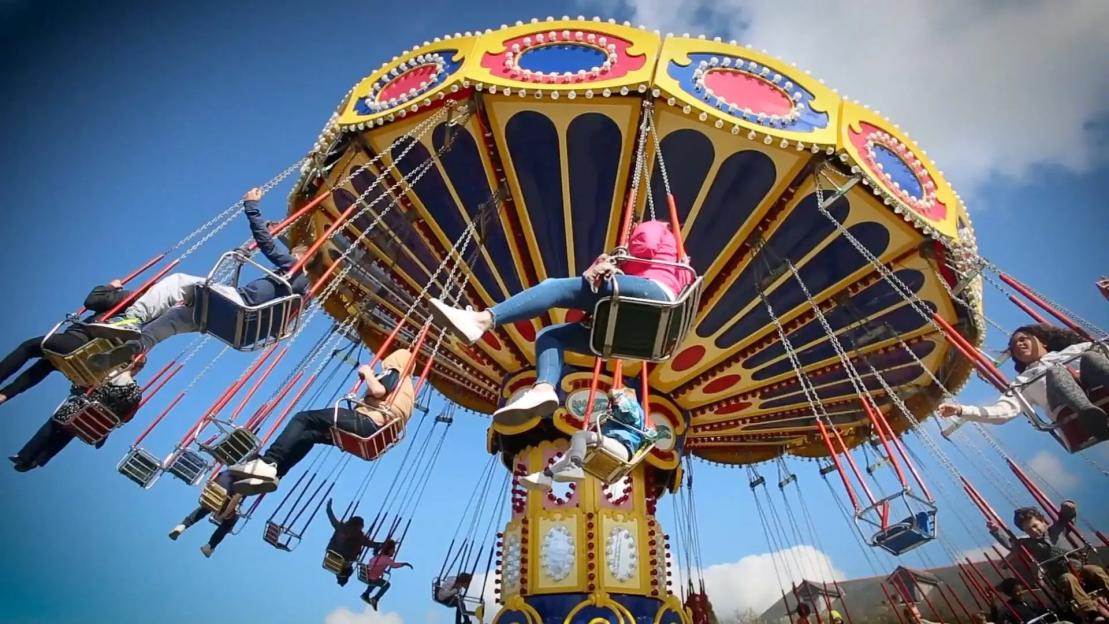 People riding a carousel at Camel Creek Adventure Park.