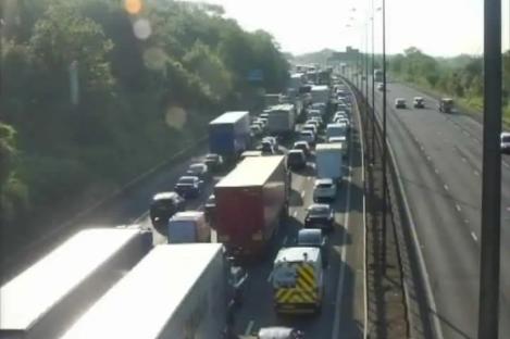 M25 closed after tanker overturns in crash with lorry as drivers face long delays and cops warn of ‘lengthy’ closure
