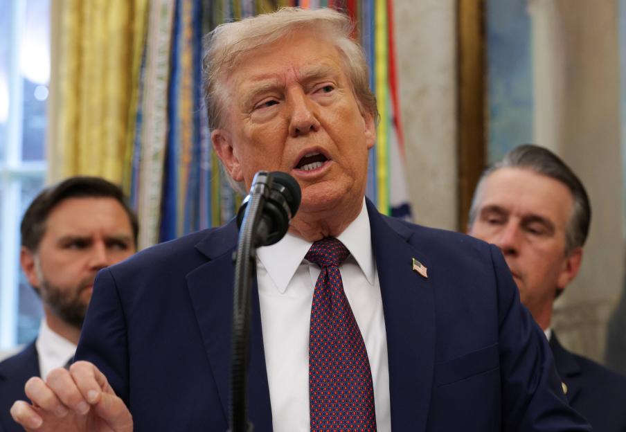 President Trump speaking at a press conference in the Oval Office.
