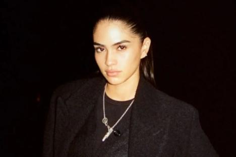 Romeo Beckham’s girlfriend Kim Turnbull flees the UK and shares sizzling new snaps after being made ‘scapegoat’ in Brooklyn feud