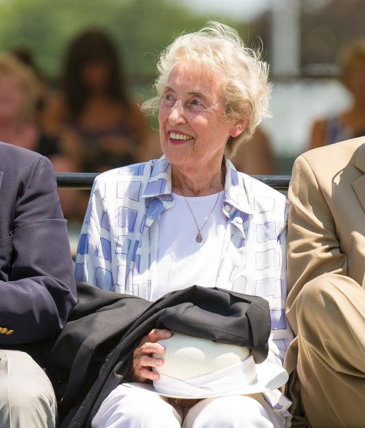 Angela Margaret Mortimer Barrett, wife of John Barrett, smiles during her husband's Hall of Fame acceptance speech.