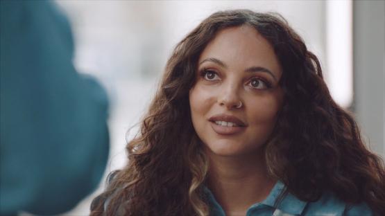 Jade Thirlwall playing a game with a group of people.