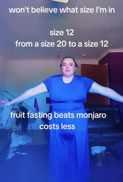 Woman in blue dress shows off weight loss from size 20 to size 12, crediting fruit fasting.