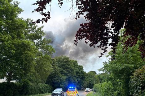 Huge fire rips through former RAF base as explosions heard and smoke seen from miles away