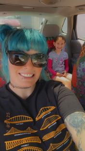 A woman and a girl in a car.