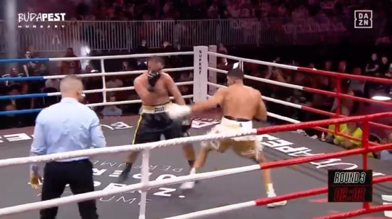 Screenshot of two boxers fighting in a boxing ring.