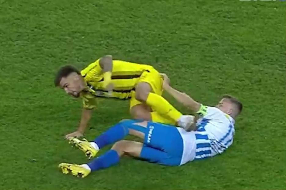 Shocking moment footballer kicks rival in privates then is immediately sent off