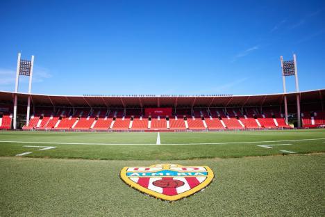 UD AlmerÃa's logo on the field of an empty soccer stadium.