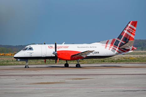 Loganair Saab 340B airplane in new tartan livery at Inverness airport.