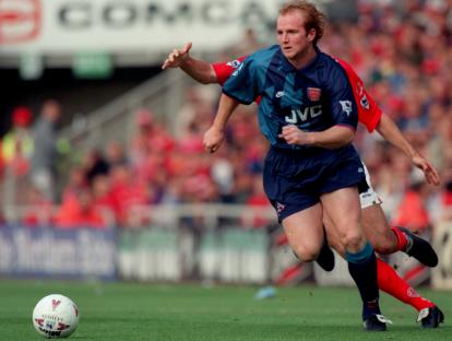 John Hartson of Arsenal running with the ball during a match against Middlesbrough.