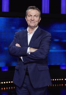 Bradley Walsh, host of The Chase, in a blue suit.