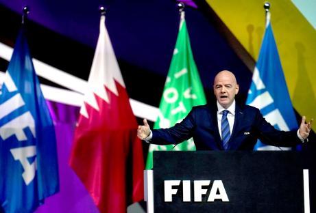 FIFA president speaking at a podium.
