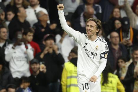 Luka Modric celebrates scoring a goal.