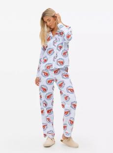 Woman modeling light blue pajama set with shrimp print.