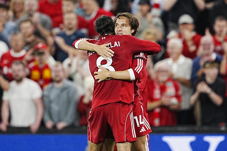 Liverpool players celebrating a goal.