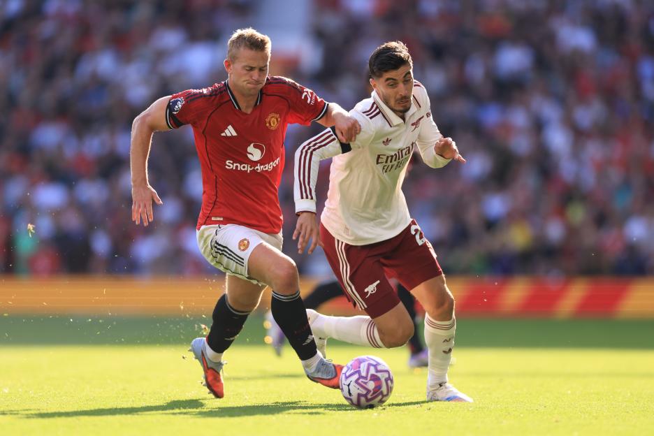 Kai Havertz of Arsenal pressured by Matthijis de Ligt of Manchester United during a soccer match.