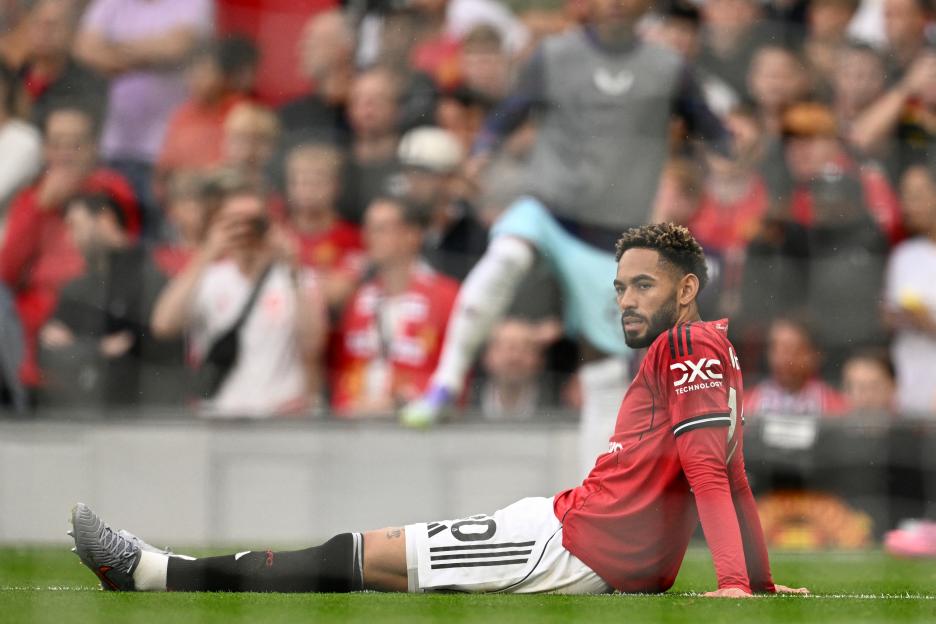 Manchester United's Matheus Cunha injured on the pitch.
