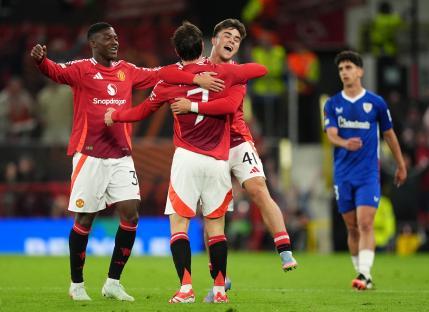Manchester United players celebrating a goal.