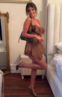 Woman in brown dress and leopard print heels.