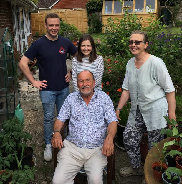 Steve Holbrook-Sishton with his family in a garden.