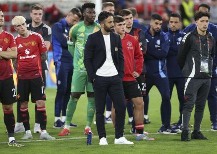 Manchester United manager Ruben Amorim looking dejected after a soccer game.