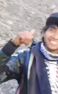 Person giving thumbs up near volcano.