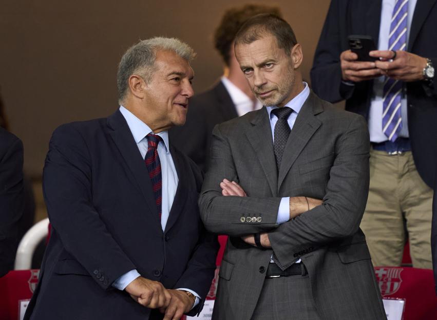 FC Barcelona president Joan Laporta and UEFA president Aleksander Ceferin engage in conversation.