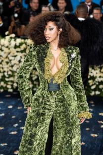 Cardi B at the Met Gala in a green velvet suit.