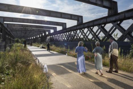 People listening to presentations at Castlefield Viaduct.