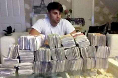 Brazen Albanian drug dealer who posed flaunting £250k cash from heroin sales is allowed to stay in UK