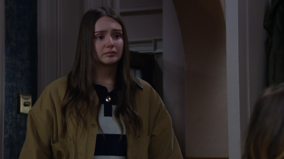 Screenshot of a young woman looking upset.