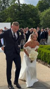 Bride and groom laughing at wedding ceremony.