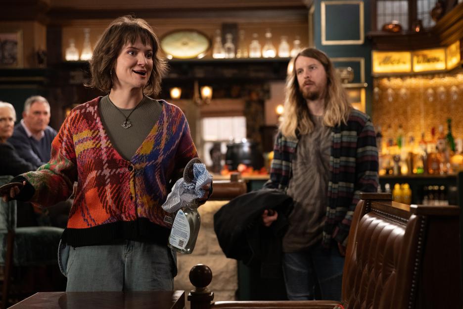 Still from Emmerdale showing Gail and Ryan in a pub.