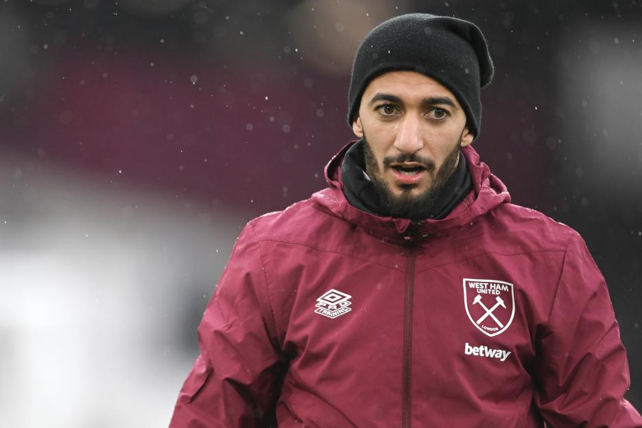 Saïd Benrahma in a West Ham United jacket warming up.