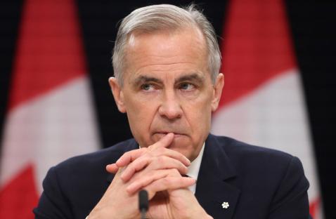 Close-up of Mark Carney at a press conference.