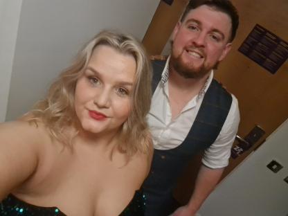 A woman and a man posing for a photo.