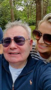 Eamonn Holmes and Katie Alexander smiling for a selfie.