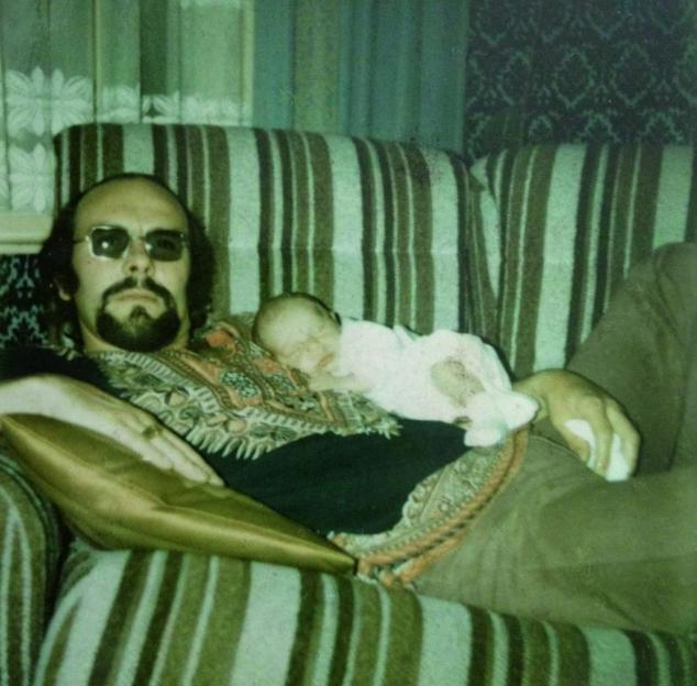 Photo of Mickey Calvey holding his newborn son Neil.