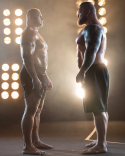 Two muscular men facing each other.