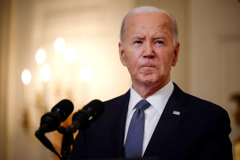 President Biden speaking at a podium.