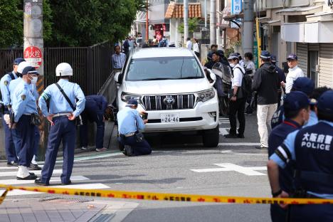 Police investigating a car accident involving children in Osaka, Japan.
