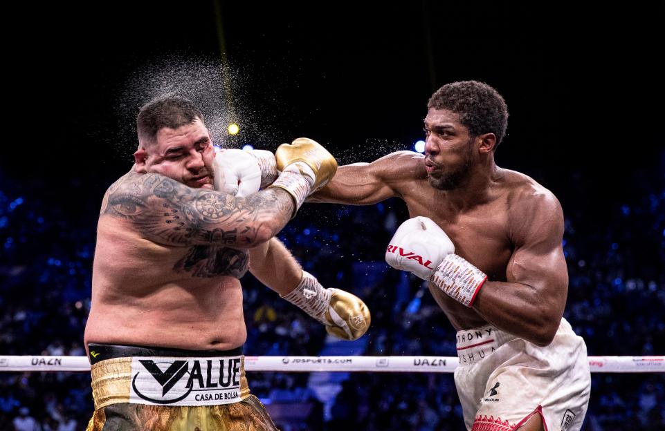Anthony Joshua punches Andy Ruiz Jr. during a boxing match.