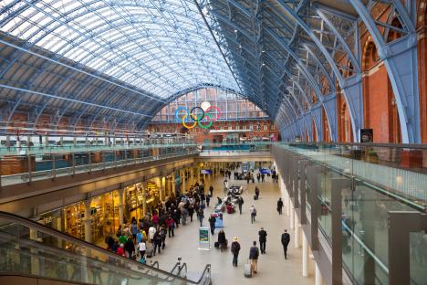 Interior view of St Pancras International station in London, showing the Olympic rings.
