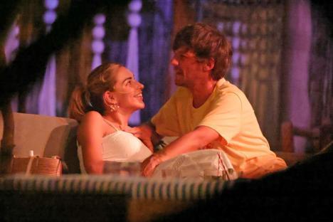 Louis Tomlinson and Zara McDermott embracing at Banana Beach in Costa Rica.