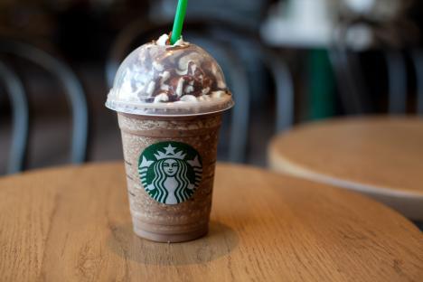 Starbucks Frappuccino on a wooden table.