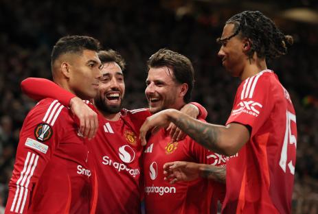 Manchester United players celebrating a goal.