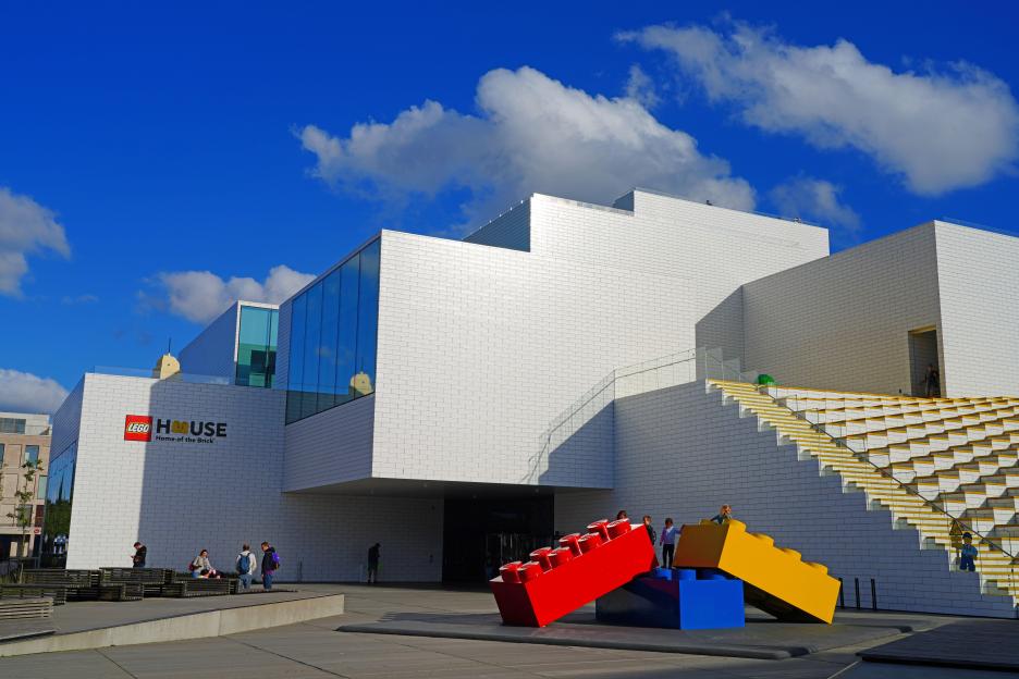 The entrance to Legoland Billund in Denmark with people walking through the gate.