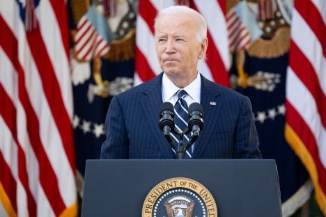 President Biden speaking at a podium.